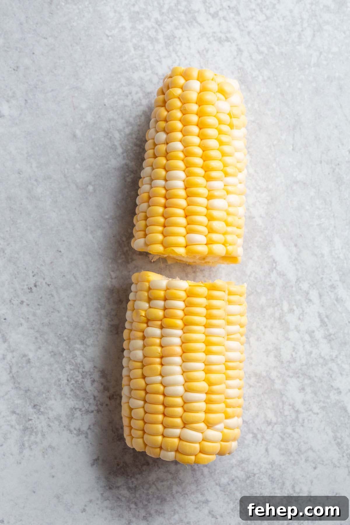 Crispy Air Fryer Corn Ribs Recipe for Summer BBQs 3 Corn cut in half.