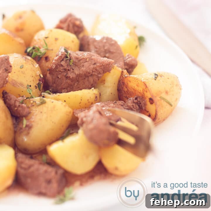 A square photo with a white plate filled with potatoes and steak. A golden fork takes a piece of steak