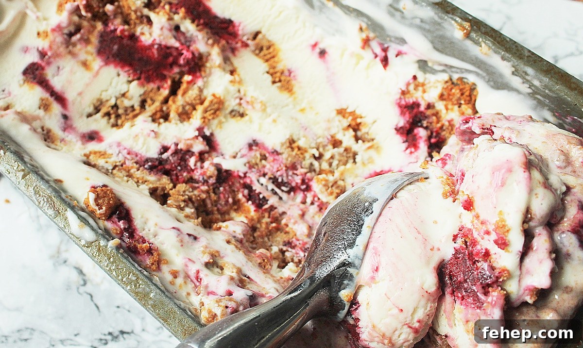 scooping blackberry cheesecake ice cream