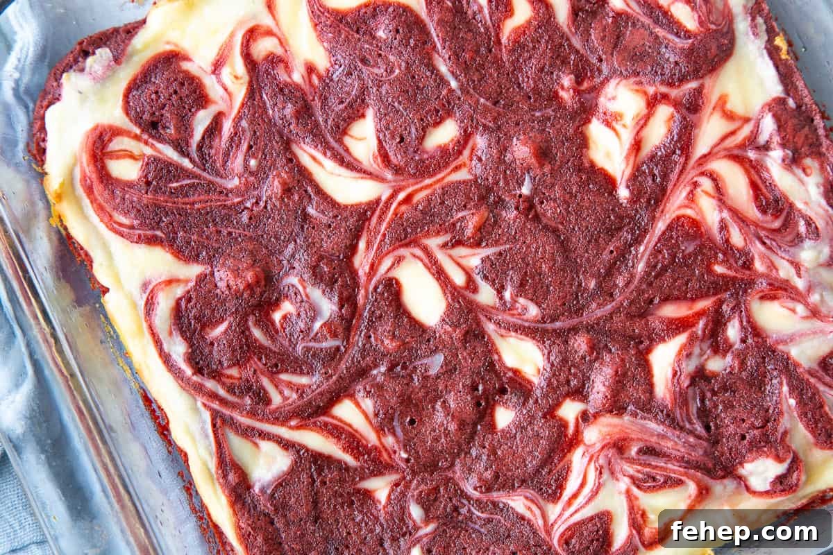 pan of red velvet brownies with a swirled top.