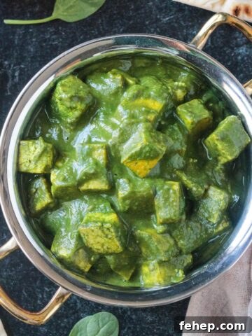 Palak Tofu in a copper serving bowl.