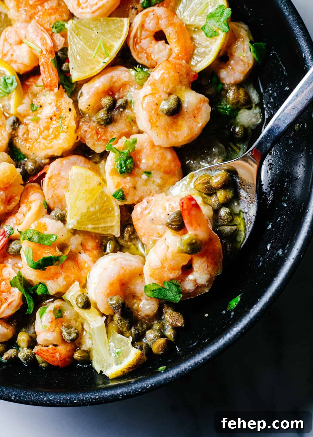 Shrimp Piccata in a skillet photographed from the top.