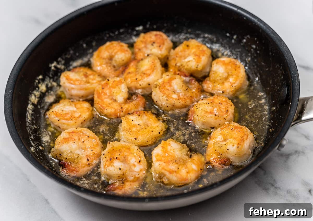 cooked shrimp in skillet.