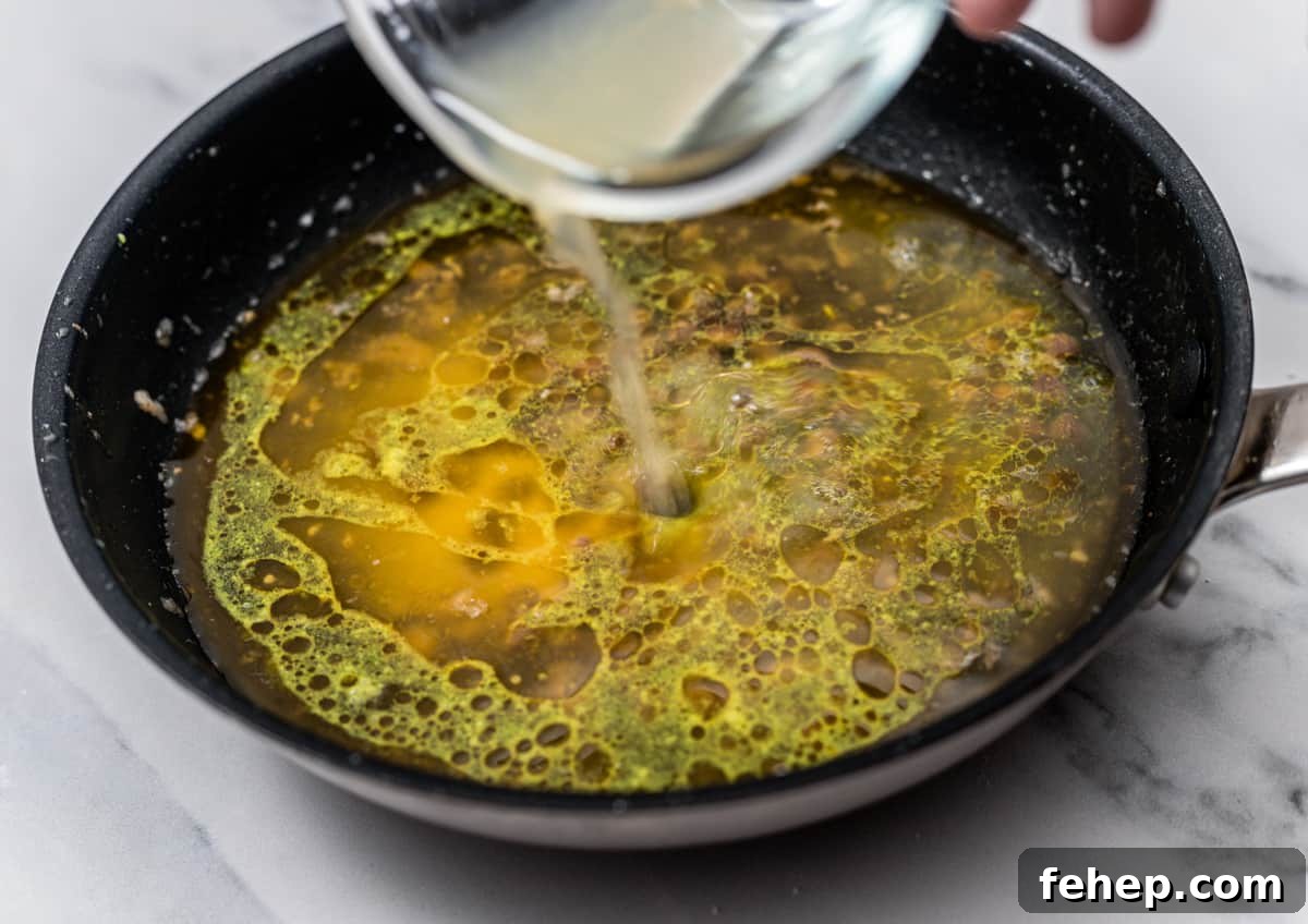 adding lemon juice to skillet.
