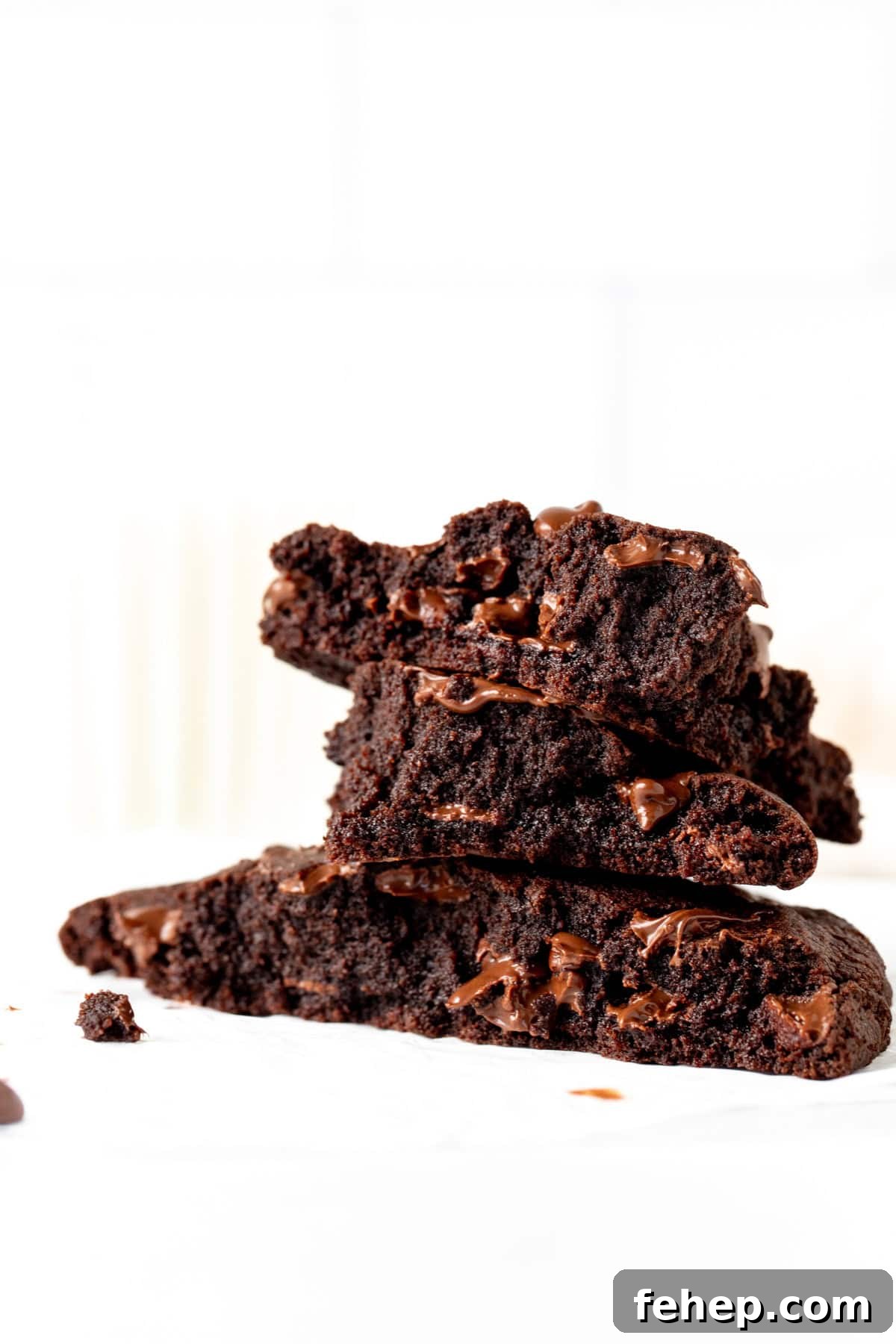 Single-Serve Chocolate Cookie Recipe: Moist Microwave Mug Cookie 8 Single serving double chocolate cookie broken into pieces, with pieces stacked on top of each other