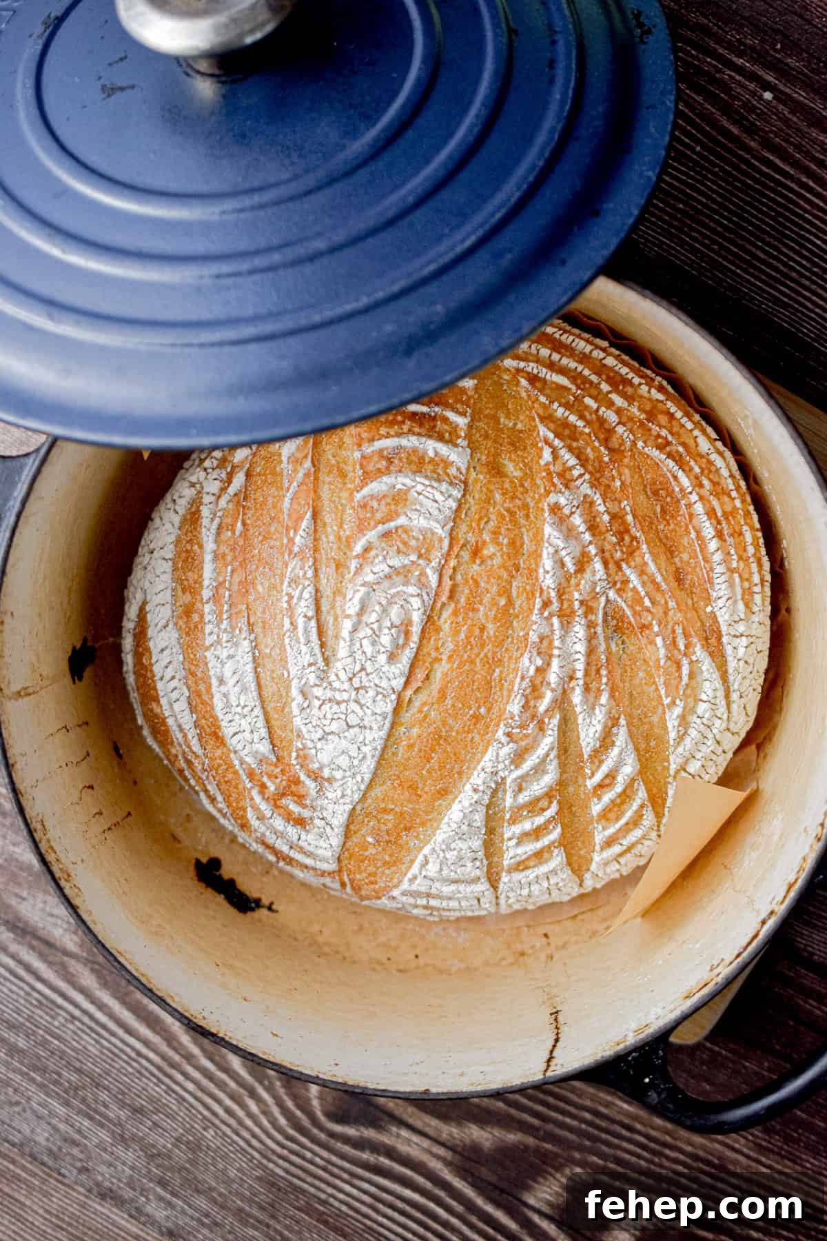 A lid is half on the Dutch oven.