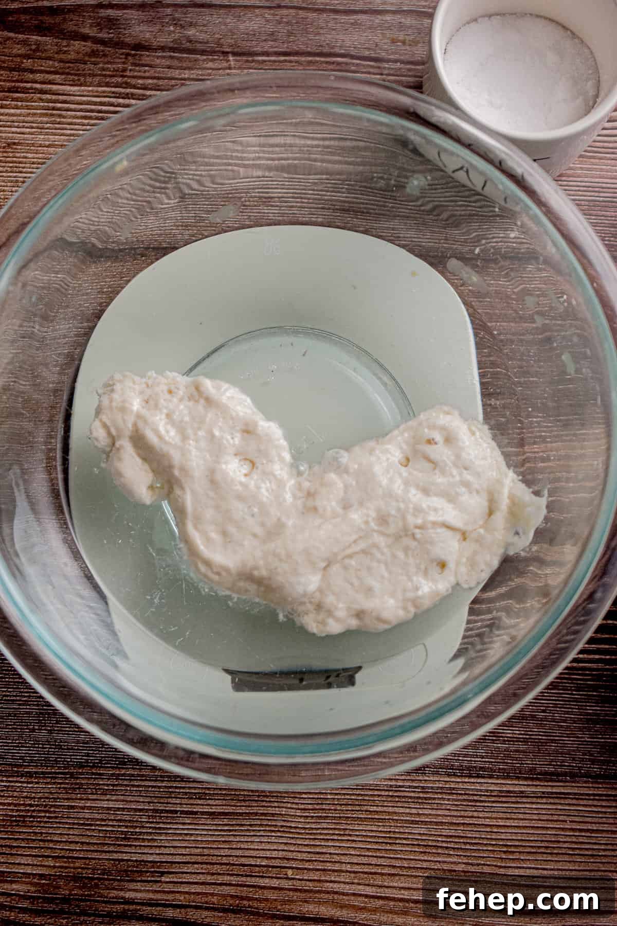 The sourdough starter is in a bowl of water.
