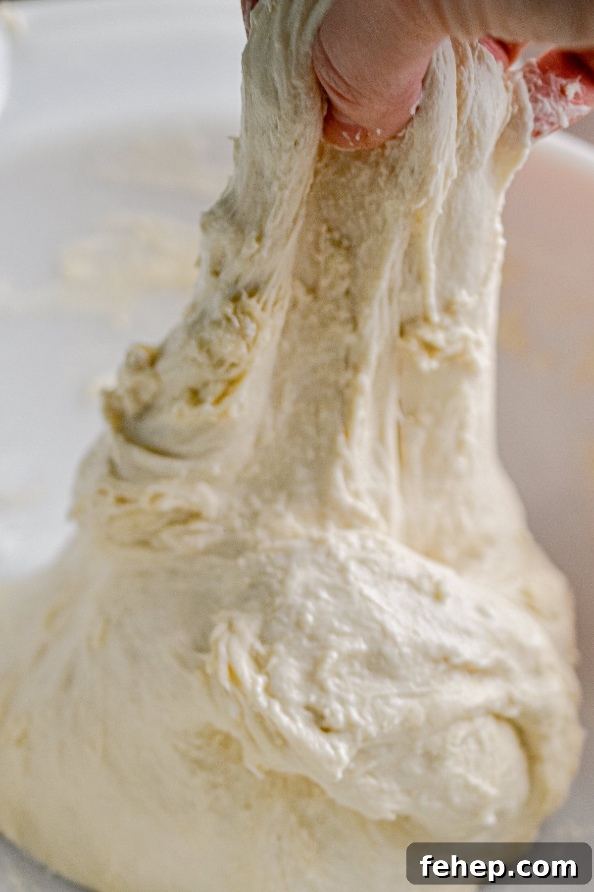 A stretch and fold is being done on the dough.
