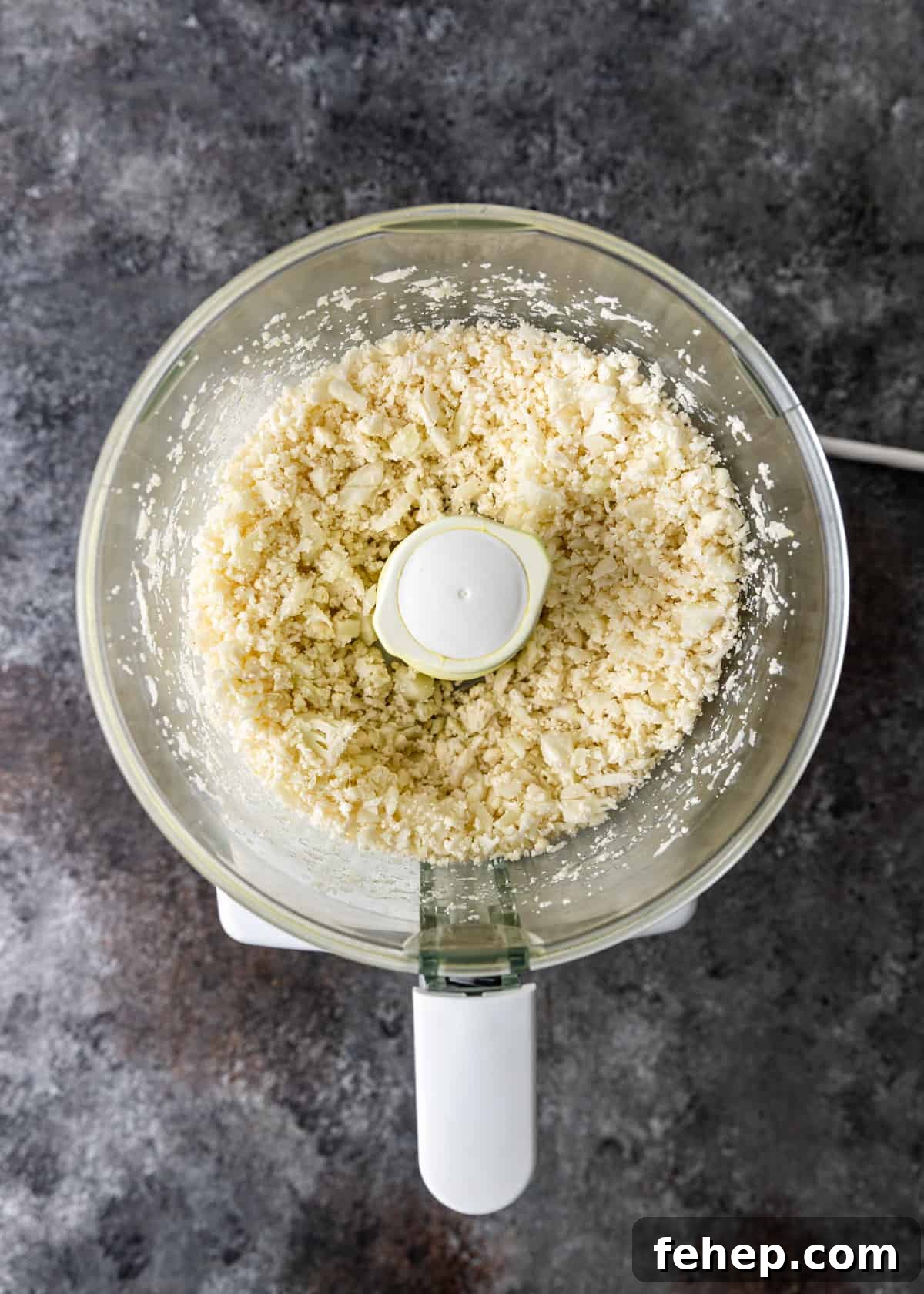 Cauliflower Tabbouleh Salad with Fresh Herbs and Lemon Vinaigrette 6 overhead: processed raw cauliflower in a food processort