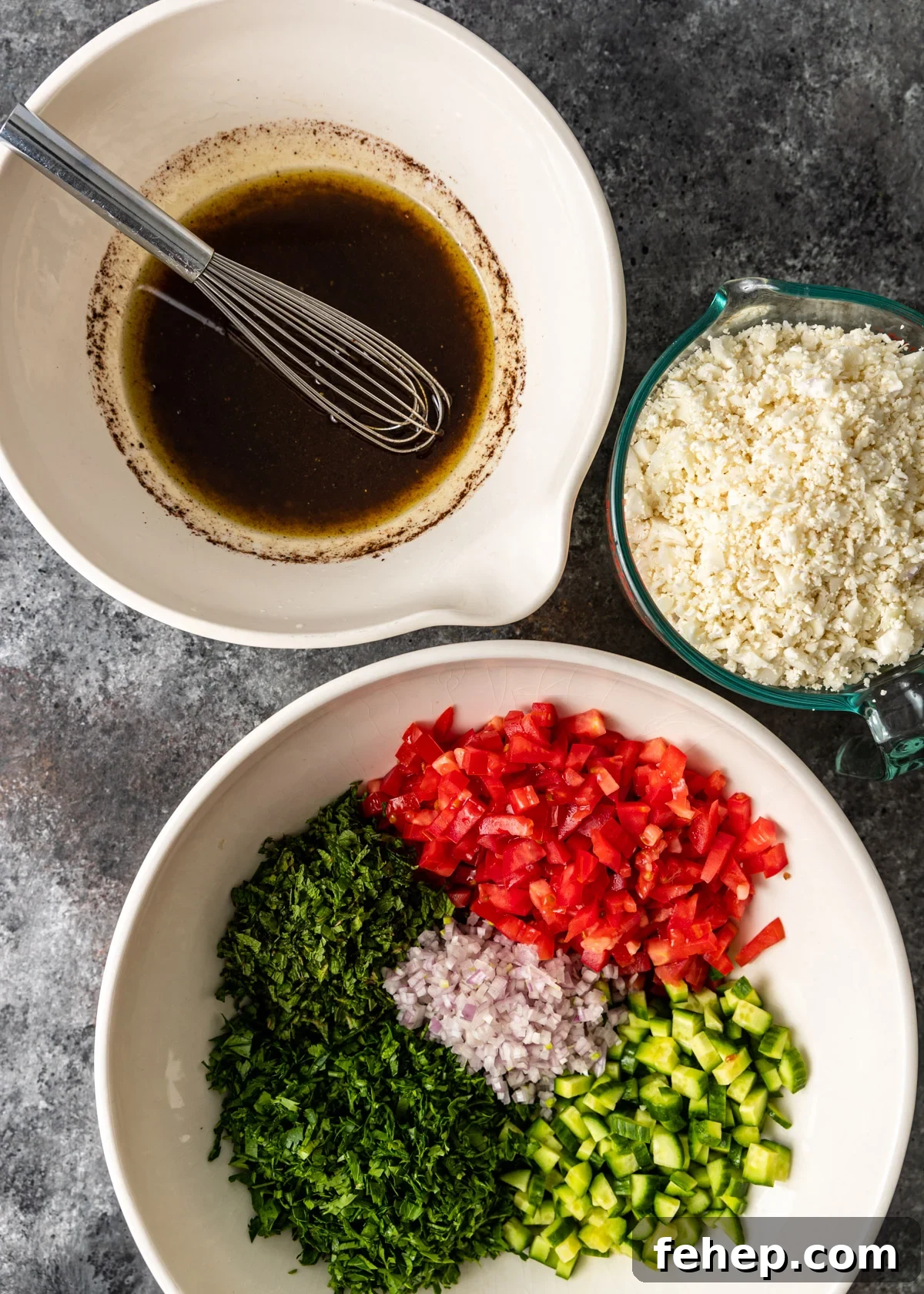 Cauliflower Tabbouleh Salad with Fresh Herbs and Lemon Vinaigrette 7 overhead: preparing the dressing and other ingredients for cauliflower tabbouleh