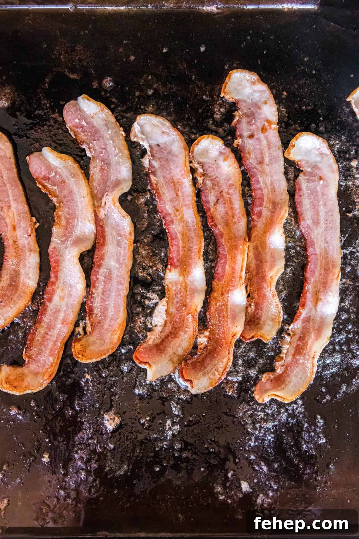 Bacon on Pre-Heated Blackstone for Bacon Cheeseburger Sliders