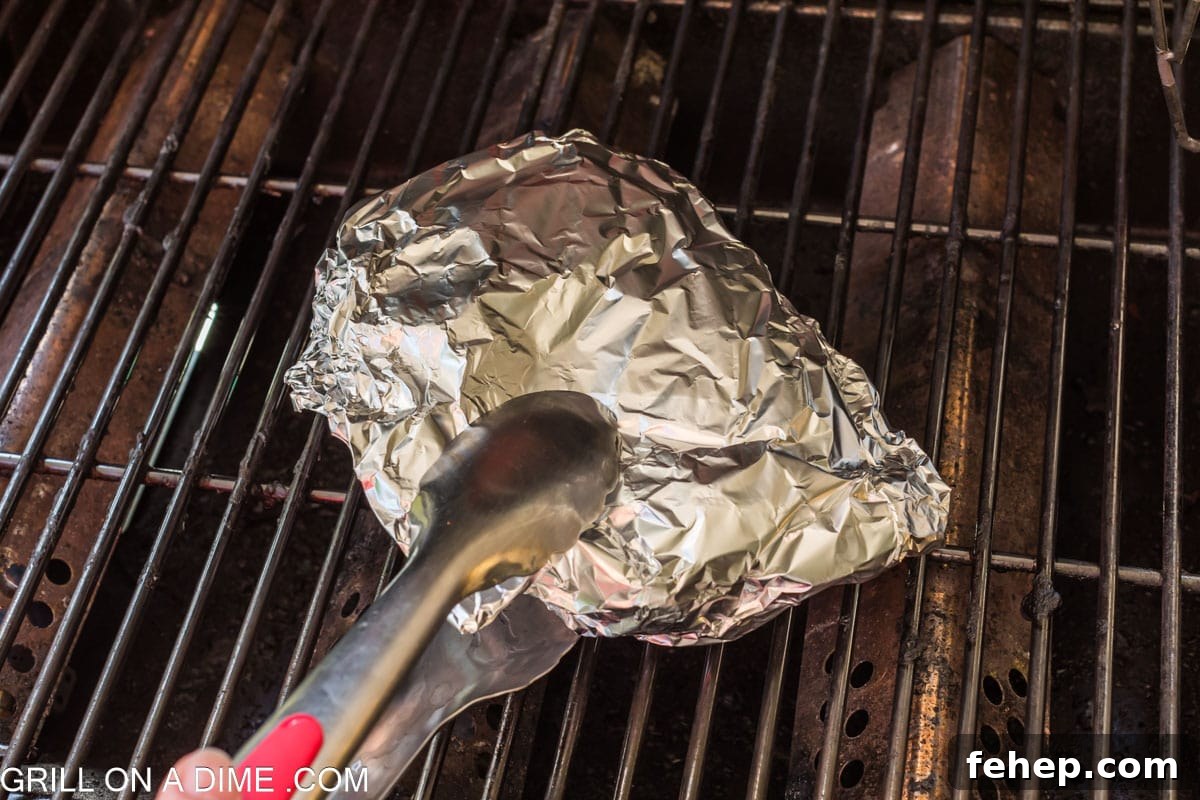 Placing foil packs on the grill