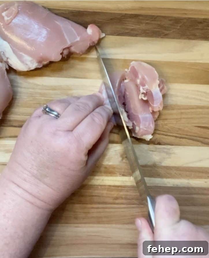 cutting chicken on board