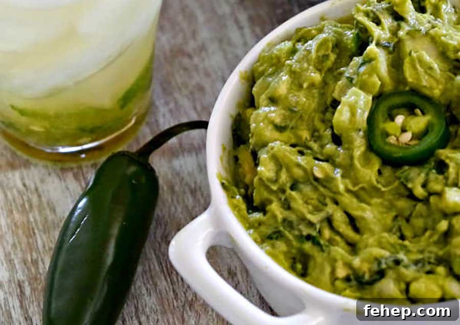 26 Addictive Gluten-Free Game Day Recipes Fans Devour 14 guacamole in a bowl with jalapenos