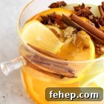 Cozy Fall Simmer Pot Recipe for a Home-Filling Autumn Scent 10 Lemons, apples, oranges, and cinnamon in a pot.