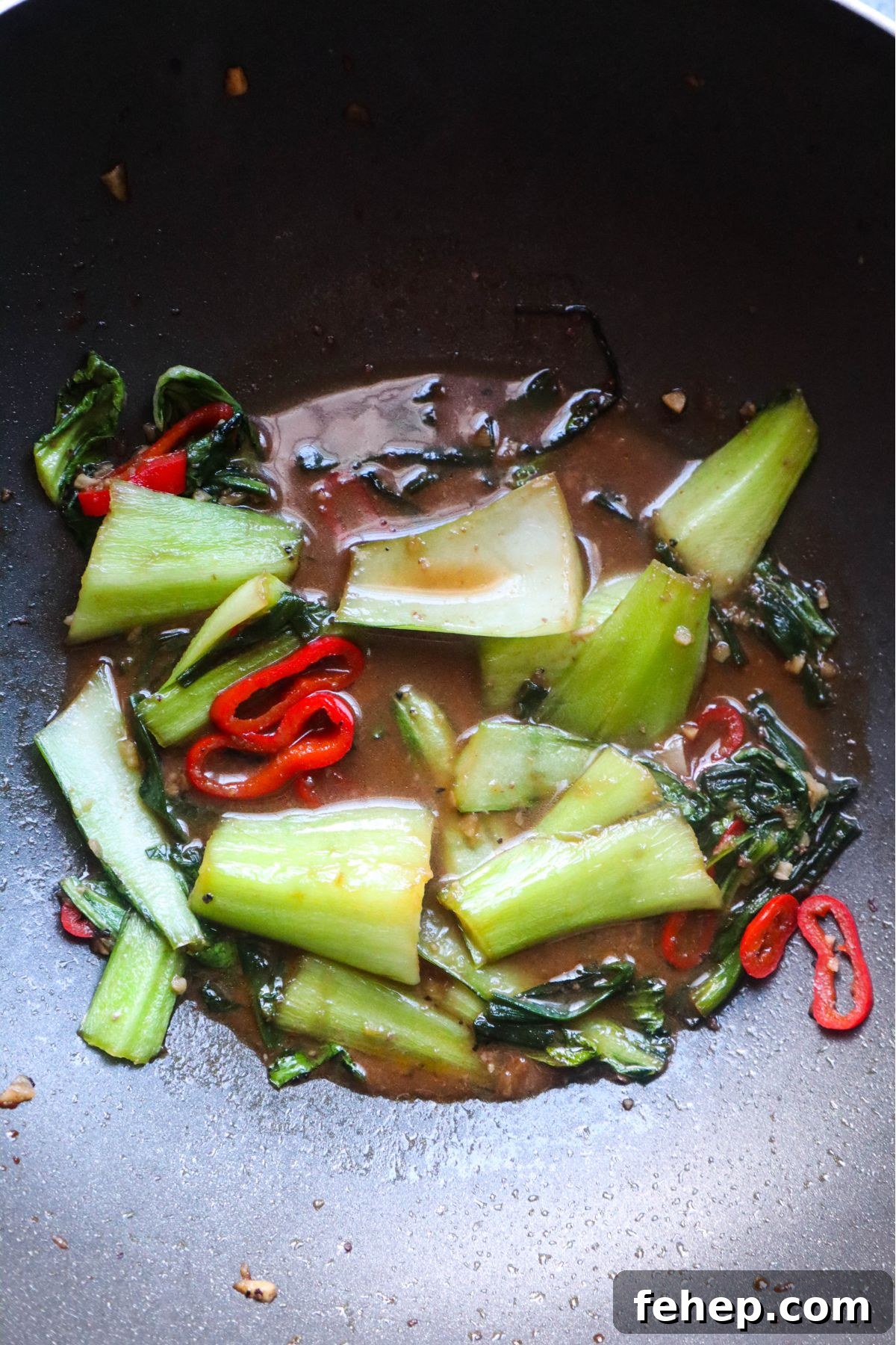 Stir-Fried Vietnamese Pho with Beef and Noodles 5 wok with vegetables cooked in a stir fry sauce.