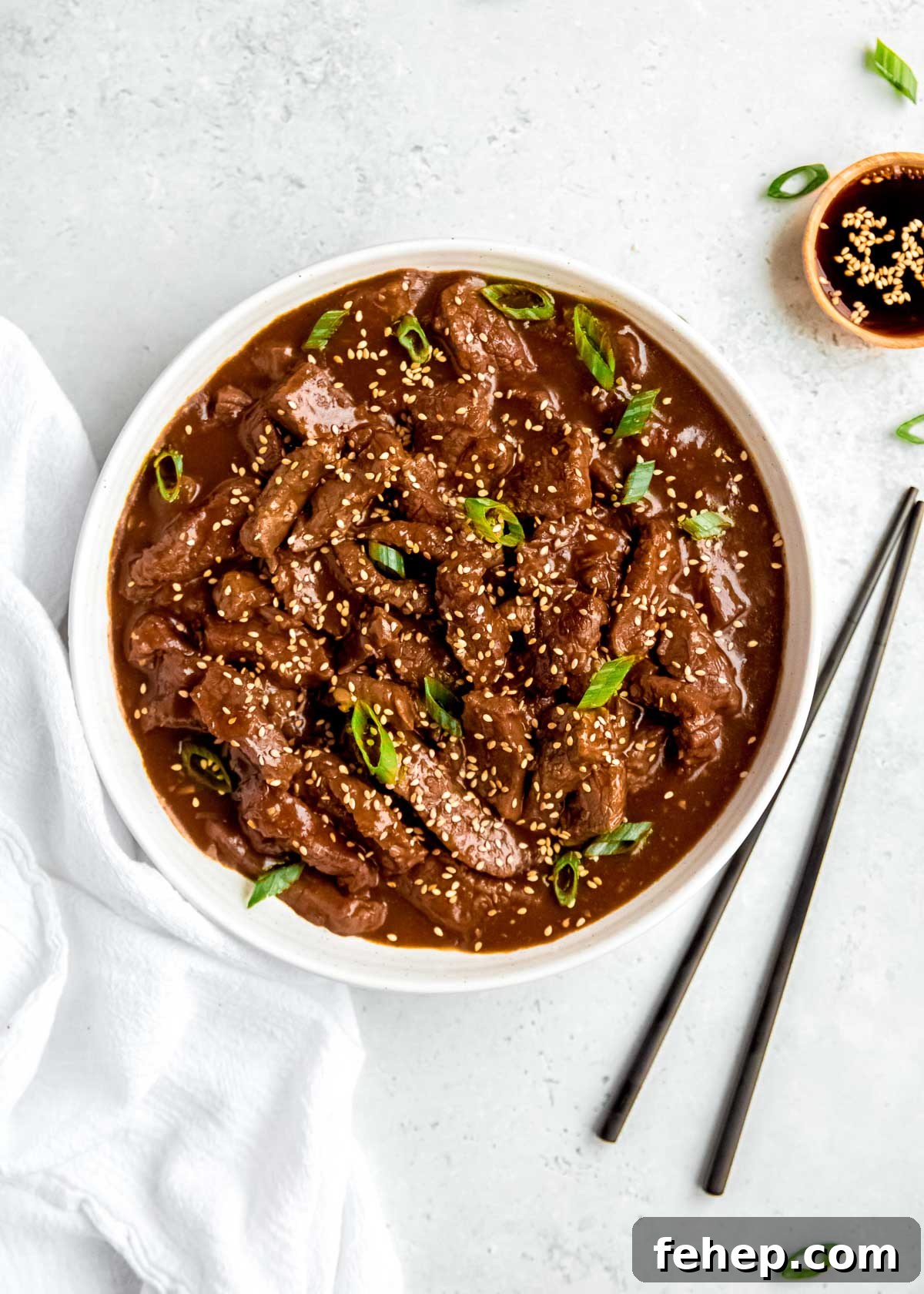 Instant Pot Mongolian Beef Recipe — Tender, Savory Weeknight Meal 9 Mongolian Beef in bowl with chopsticks