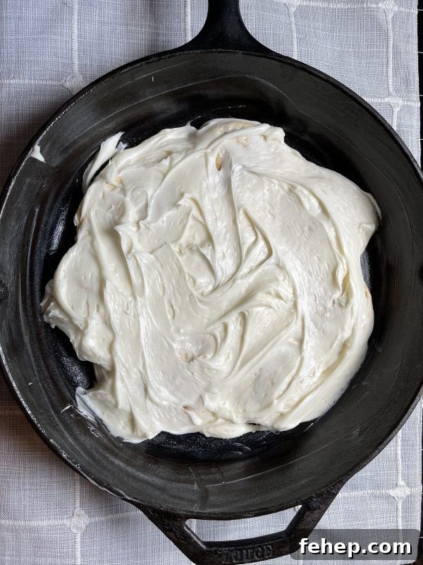Cinnamon Roll Dessert Casserole frosting layer
