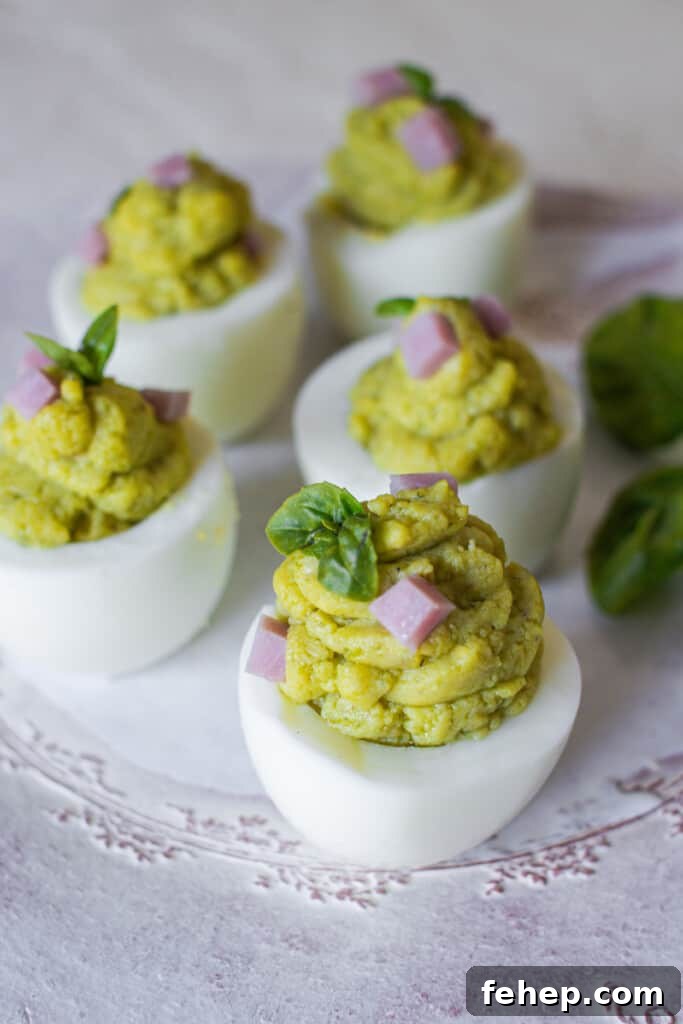 The Deviled Eggs Recipe You’ll Make Again and Again 3 Deviled eggs on light background