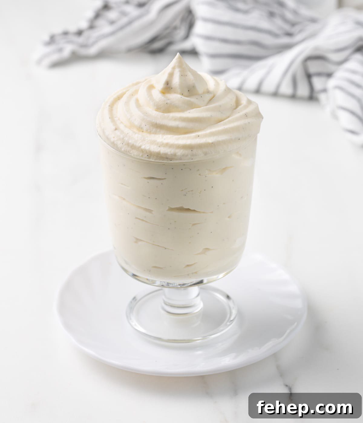 How to Make Classic Chantilly Cream (Crème Chantilly) 8 Cream piped inside a serving cup.