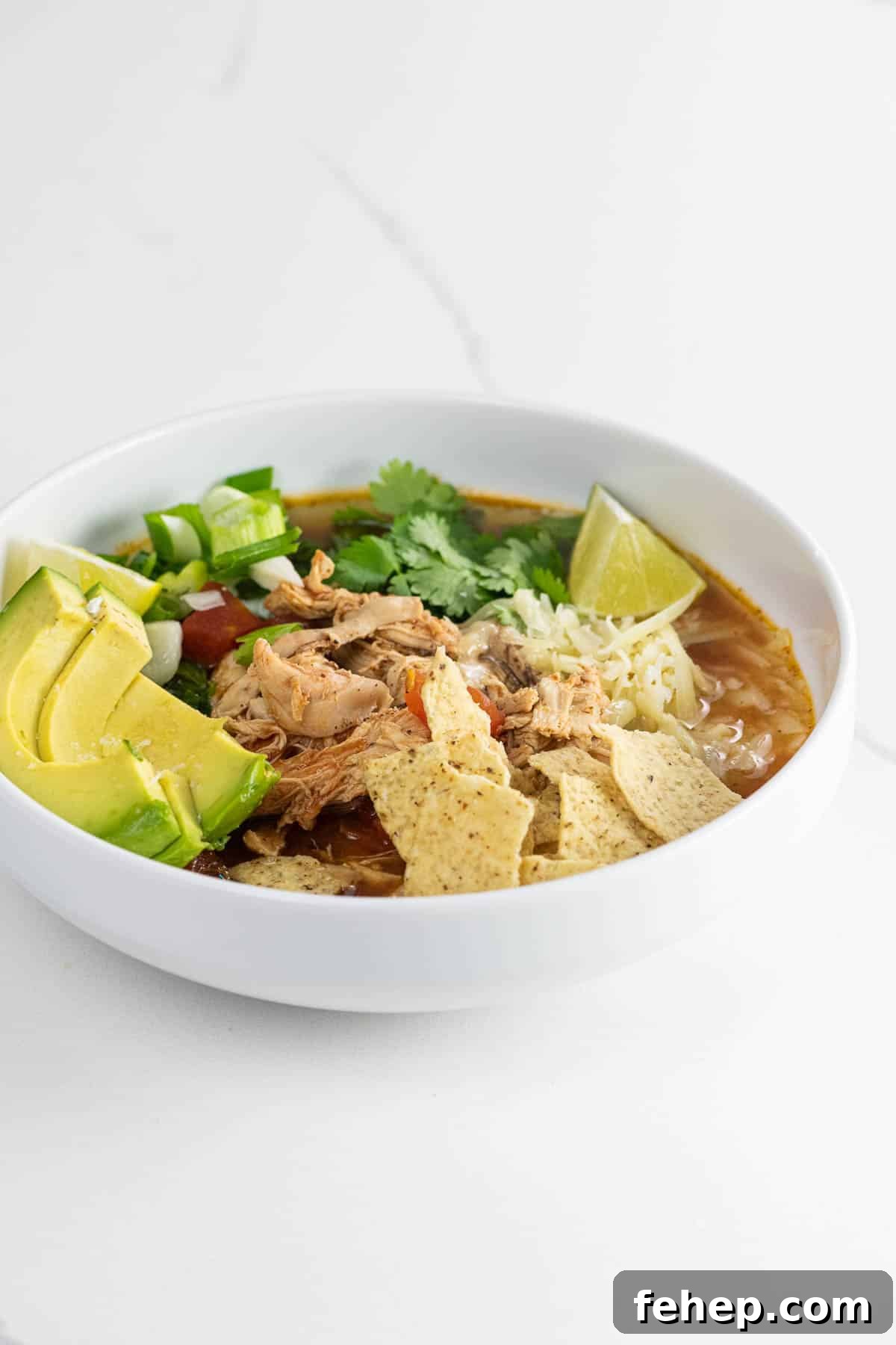 rotisserie chicken tortilla soup in a white bowl