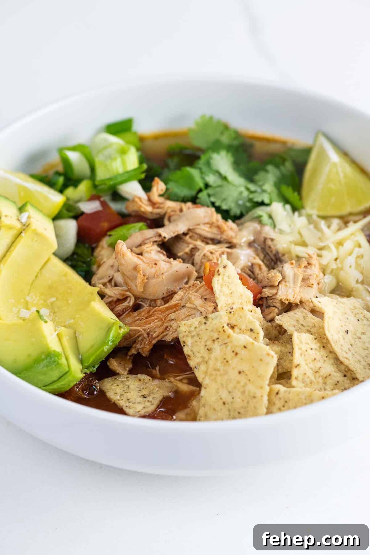 rotisserie chicken tortilla soup in a white bowl