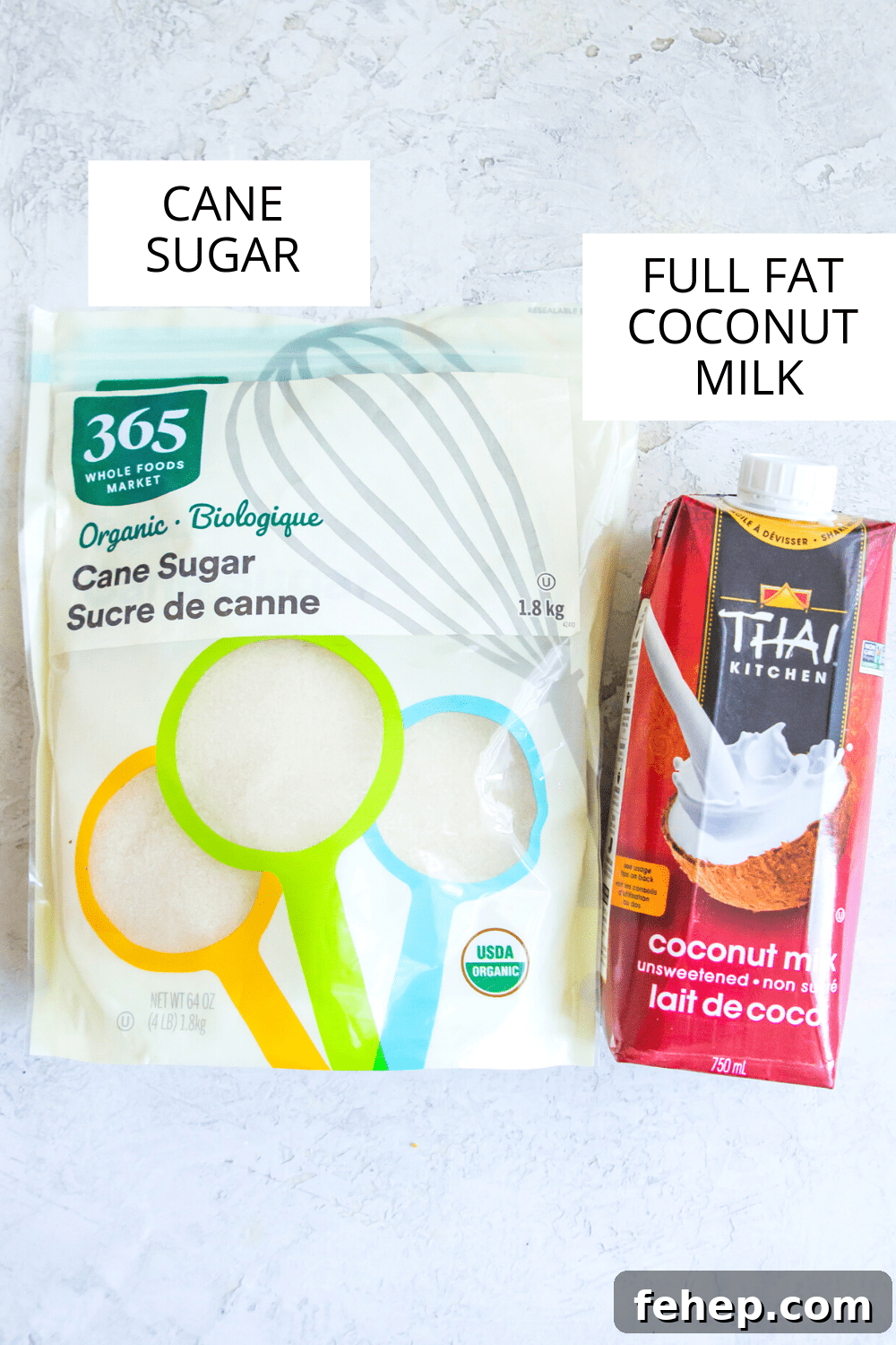 A bag of cane sugar and a box of coconut milk.