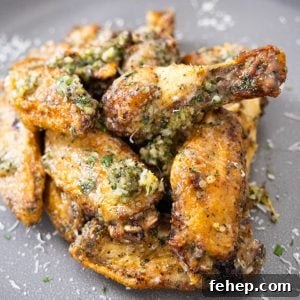 Crispy Air Fryer Garlic Parmesan Chicken Wings 9 air fryer garlic parm wings piled neatly on a plate