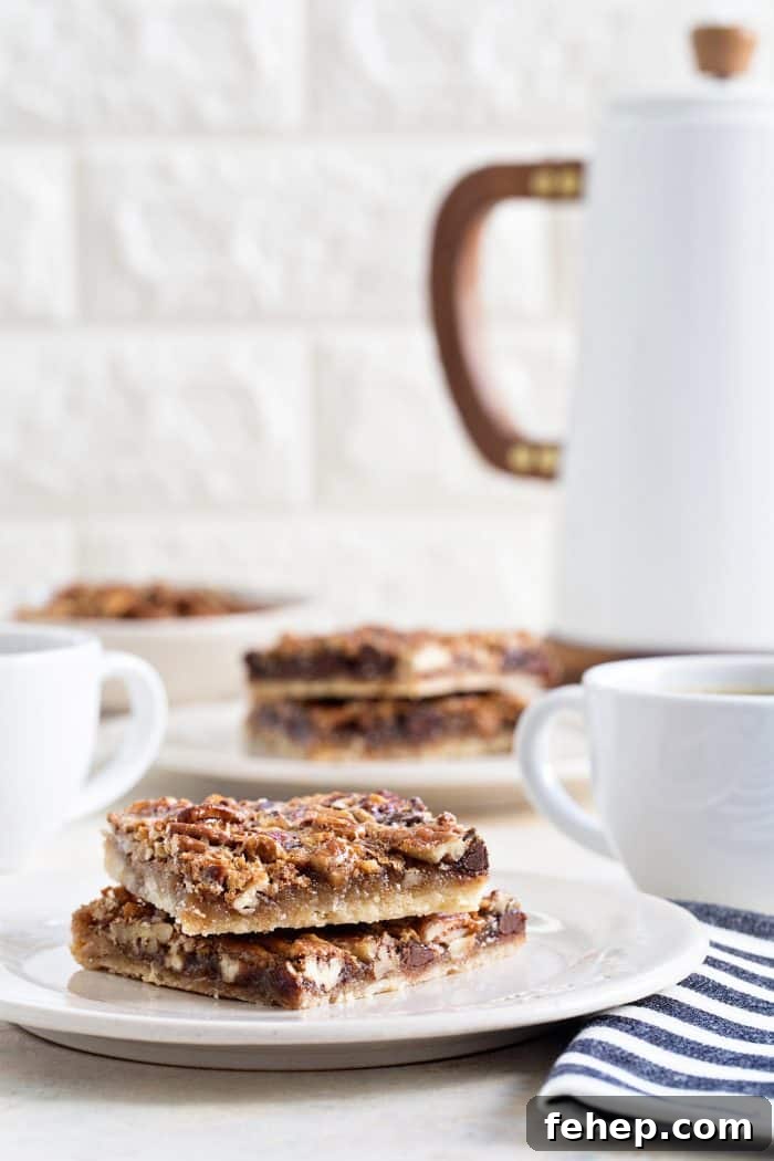 Bourbon Chocolate Pecan Bars Recipe with Gooey Caramel Layers 2 Chocolate Bourbon Pecan Bars are a fun twist on classic pecan pie. They're the perfect bar dessert for the holidays!