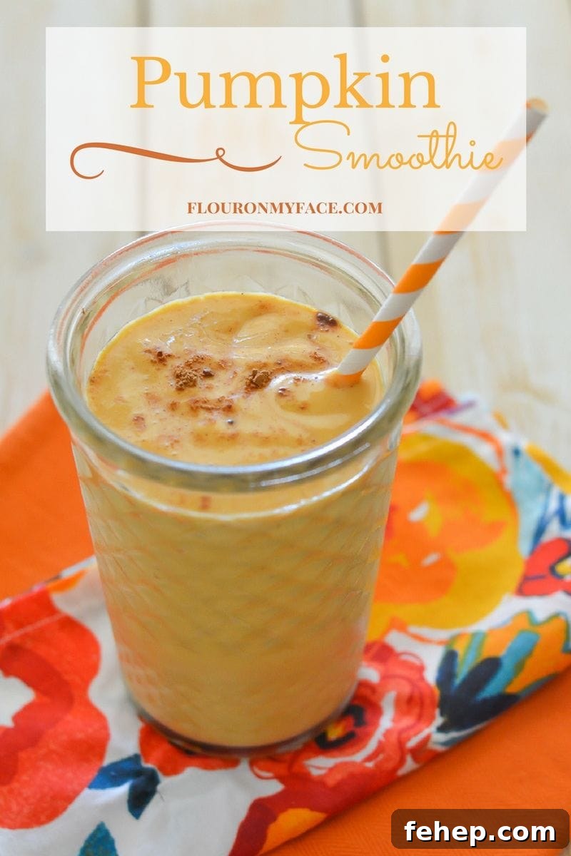 Creamy Pumpkin Smoothie — Autumn Spice Recipe for Fall Mornings 2 Featured image of the Pumpkin Smoothie recipe in a clear glass with a orange and white paper straw.