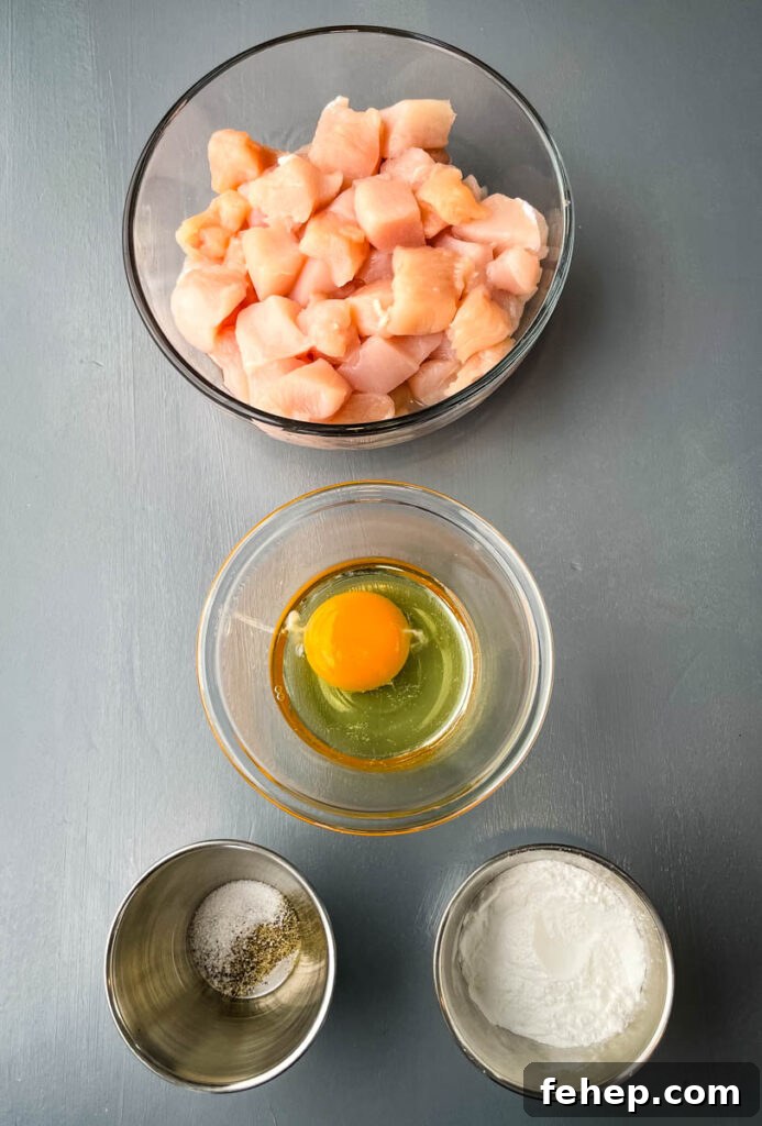 raw sliced chicken, raw egg, soy sauce, salt and pepper in separate bowls