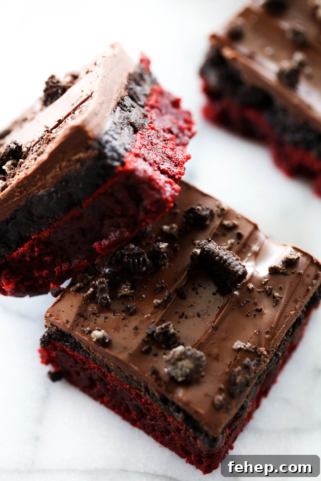 Red Velvet Oreo Truffle Brownies Recipe for Decadent Dessert 5 Serving of Red Velvet Oreo Truffle Brownies on a plate