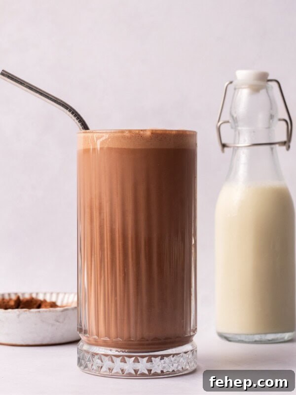 Peanut Butter Milkshake next to milk in a glass bottle.