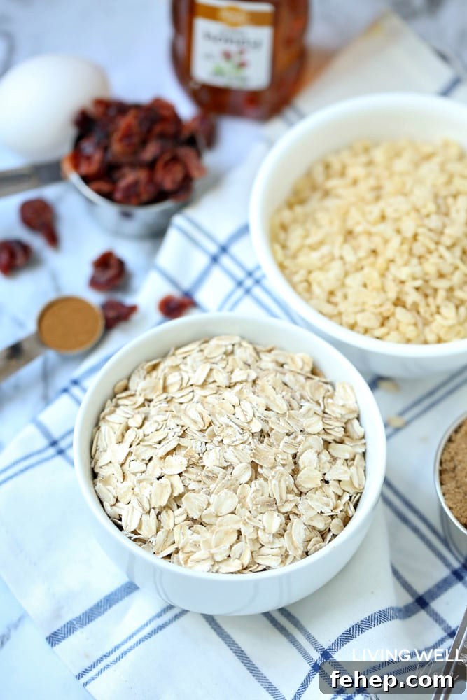 Cranberry Granola Bar Squares are a nutritious, moist, chewy granola bar square filled with oats, crispy rice, and dried cranberries. This is an easy, delicious, gluten-free and dairy-free snack recipe kids love!