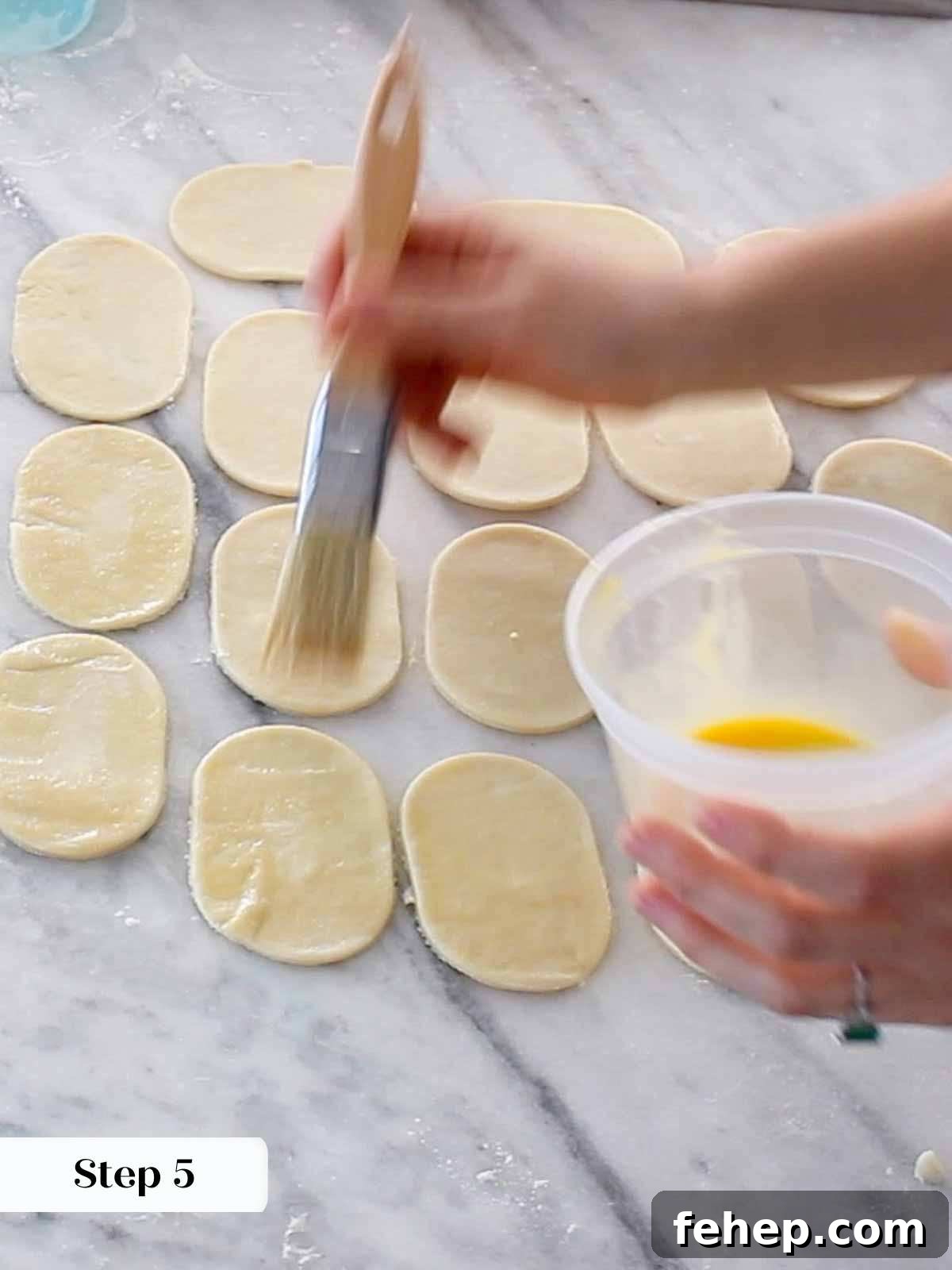Mini Apple Hand Pies: Flaky Pocket Pies with Cinnamon Filling 8 egg wash hand pie dough.