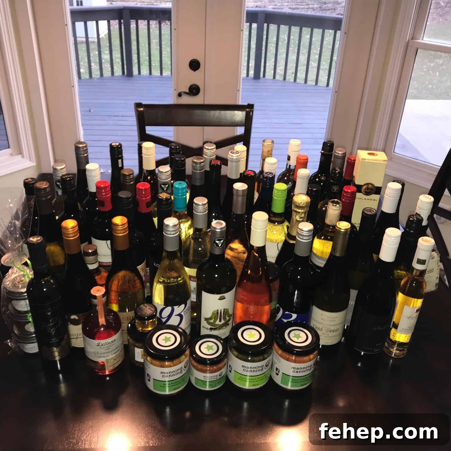 Romantic Niagara Getaway Guide: Weekend Ideas and Top Spots 4 Giant collection of wine bottles lined up on kitchen table