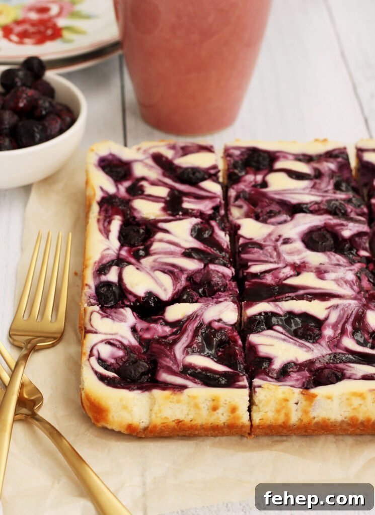 White Chocolate Blueberry Cheesecake Bars Recipe 8 blueberry swirl cheesecake bars