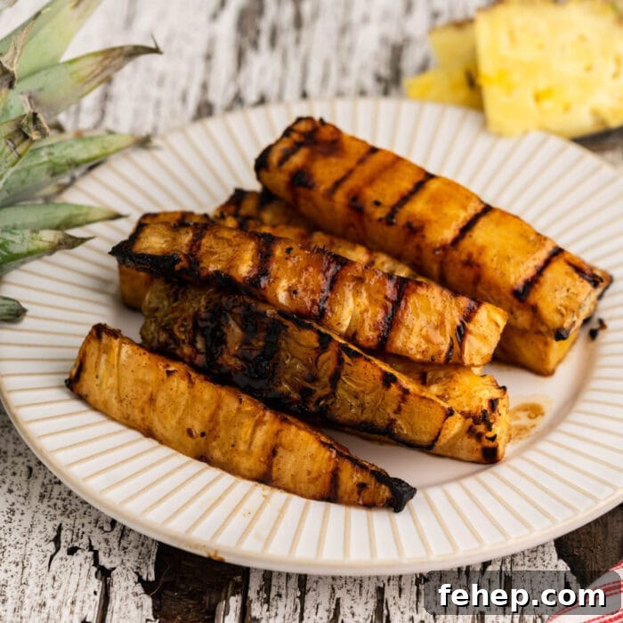 Close up of grilled pineapple showing grill marks.