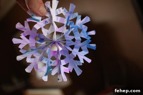 3D Paper Snowflakes: Simple Step-by-Step Folding Tutorial 3 small purple 3D snowflake
