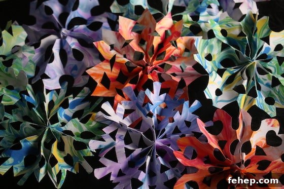 3D Paper Snowflakes: Simple Step-by-Step Folding Tutorial 4 pile of colourful 3d paper snowflakes