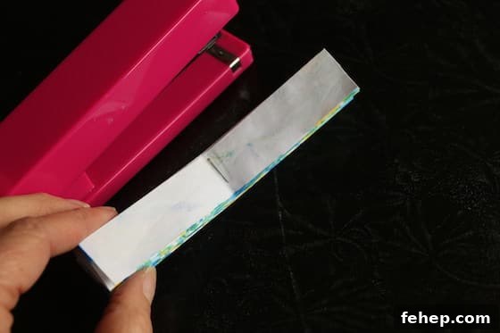 3D Paper Snowflakes: Simple Step-by-Step Folding Tutorial 7 stapler and folded paper
