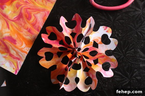 3D Paper Snowflakes: Simple Step-by-Step Folding Tutorial 9 orange snowflake with marbled paper
