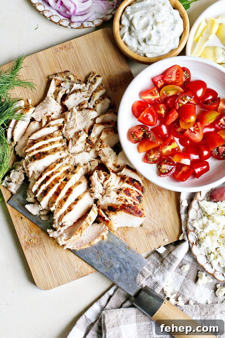 photo of sliced grilled chicken that was marinated in a Greek marinade for chicken