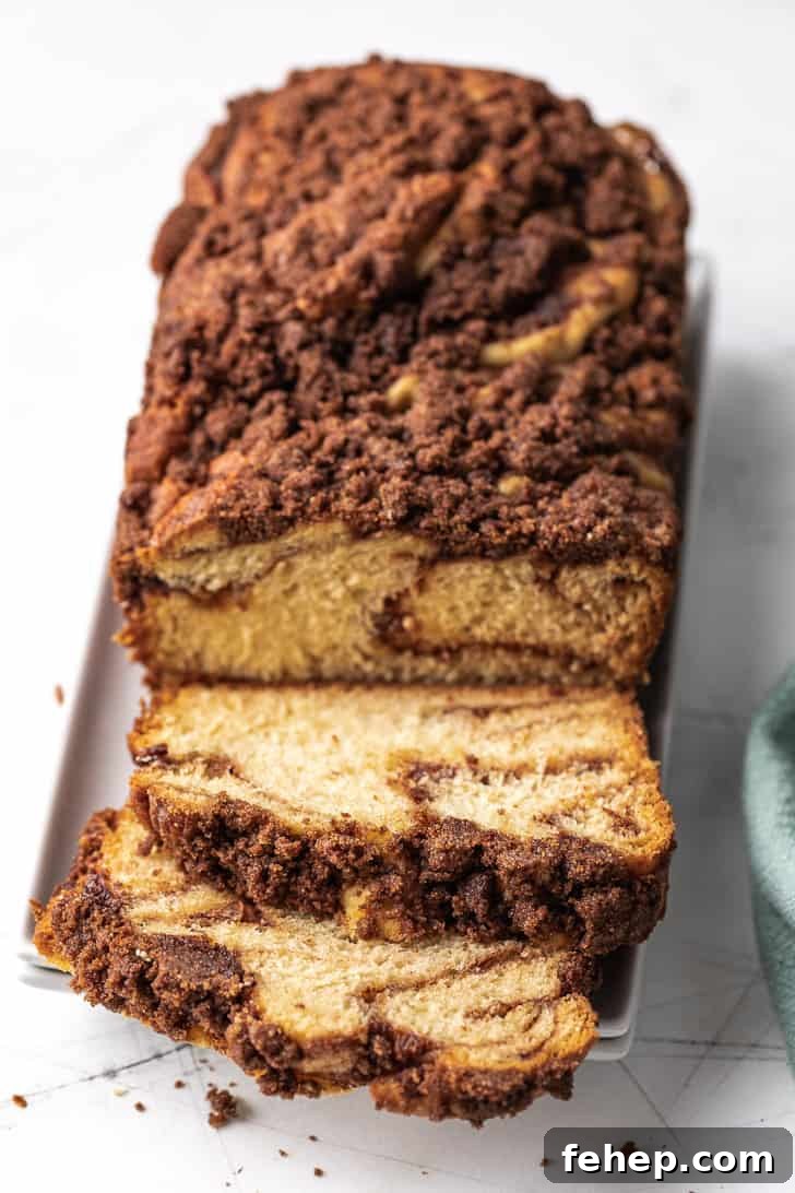 Soft Cinnamon Twist Bread Recipe: Fluffy Swirl Loaf Guide 3 Sliced loaf of bread topped with crunchy cinnamon on white plates.