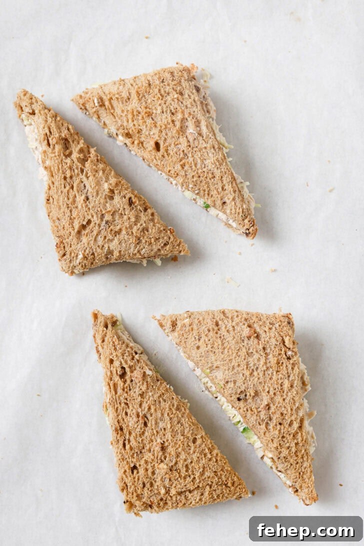 Creamy Chicken Mayo Sandwich Recipe for Balanced Flavor 17 Chicken Sandwiches cut into triangles with crust removed.