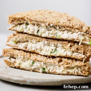Creamy Chicken Mayo Sandwich Recipe for Balanced Flavor 20 Close up of a stack of Chicken Sandwiches on a plate.