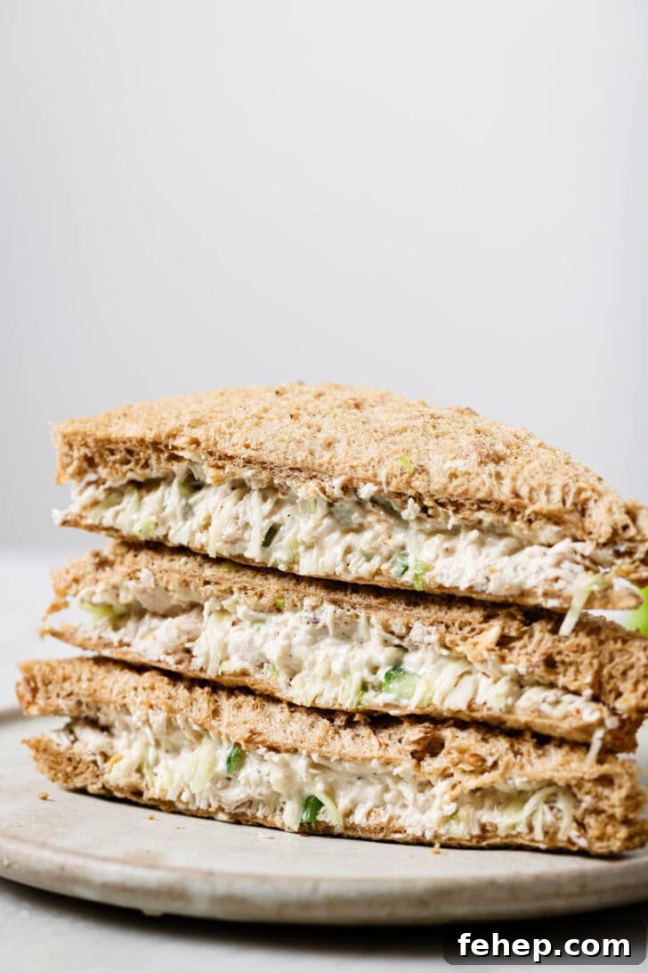 Creamy Chicken Mayo Sandwich Recipe for Balanced Flavor 4 Close up of a stack of Chicken Mayo Sandwiches on a plate.
