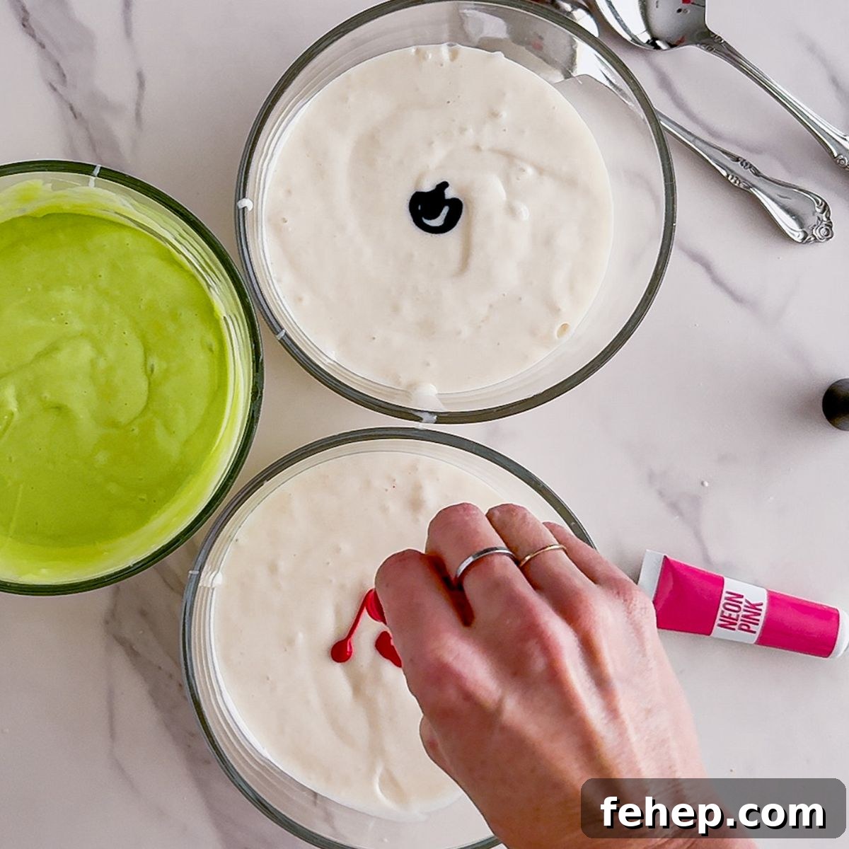 Adding dye to poke cake.