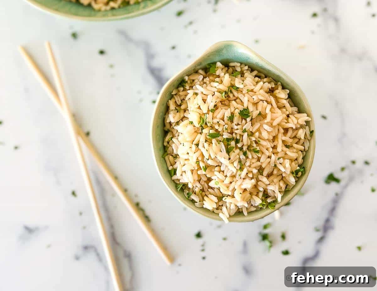 Perfectly Fluffy Brown Basmati Rice in the Instant Pot 6 Chopsticks placed next to bowl of fluffy grains garnished with chopped cilantro.