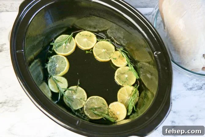 Slow-Cooked Lemon Herb Turkey Breast with Savory Gravy 4 Line crock pot with lemon.